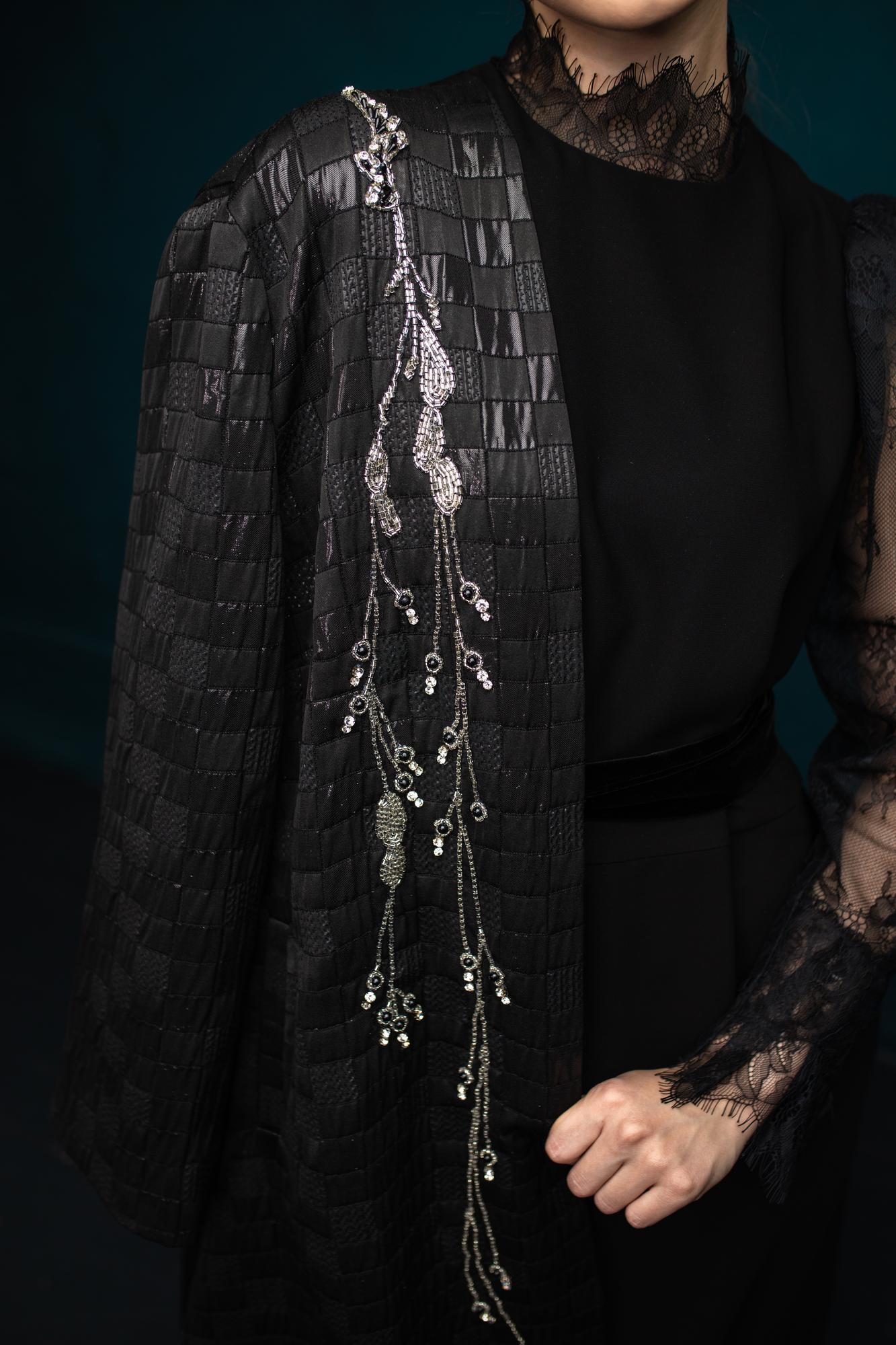 Metallic thread embroidery on evening gown